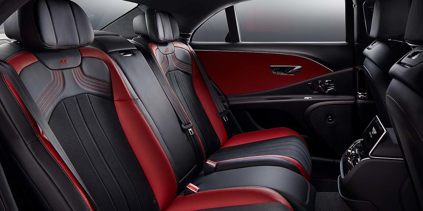 Bentley Bangkok Bentley Flying Spur S sedan rear interior in Beluga black and Hotspur red hide with S stitching