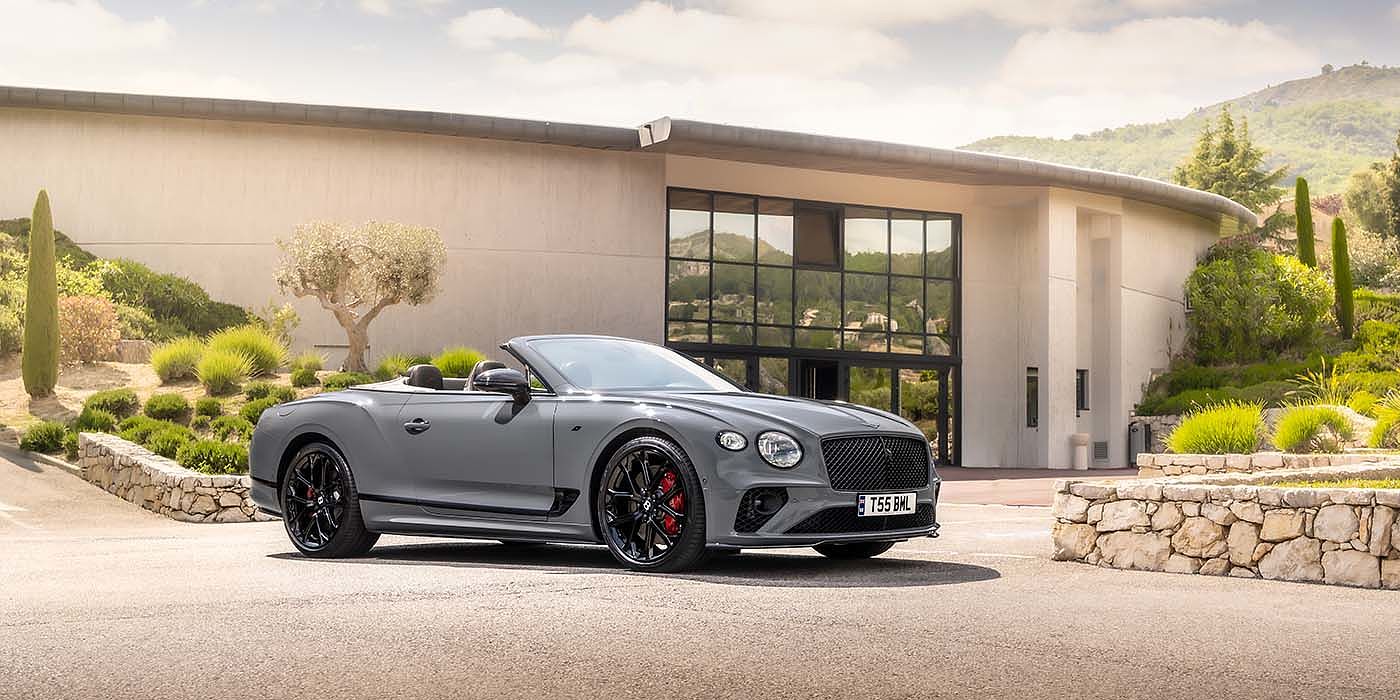 Bentley Bangkok Bentley Continental GTC S convertible in Cambrian Grey paint front 34 static near house