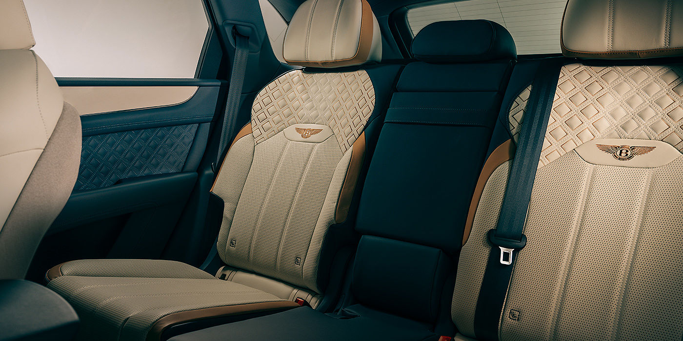 Bentley Bangkok Bentley Bentayga Odyssean Edition SUV rear interior in Linen and Brunel hides with diamond in diamond seat stitching