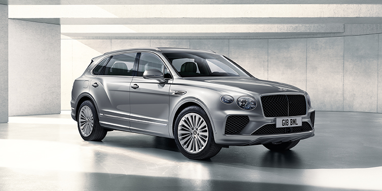 Bentley Bangkok Bentley Bentayga Extended Wheelbase SUV front three quarter in Moonbeam paint with a grey background
