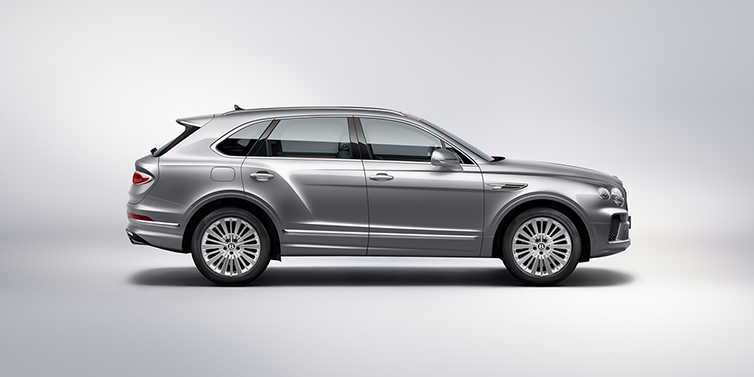 Bentley Bangkok Bentley Bentayga SUV side profile in Moonbeam silver paint against white background featuring 21 inch 5 spoke wheels