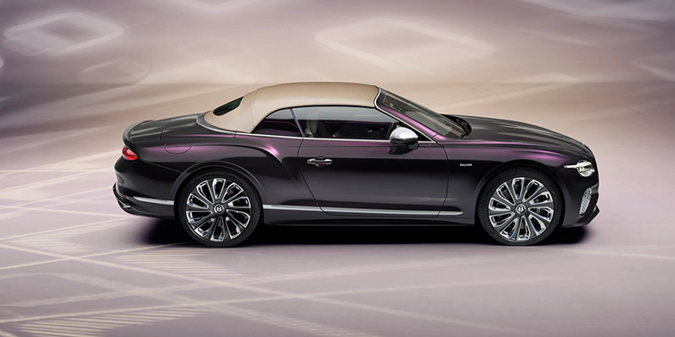 Bentley Bangkok Bentley Continental GTC Mulliner convertible in profile with hood up, in Tanzanite Purple paint and 22 inch Mulliner painted and polished wheels